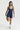 Sleek short jumpsuit dark blue in model front view - JUV