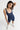 Sleek short jumpsuit dark blue in model front view - JUV