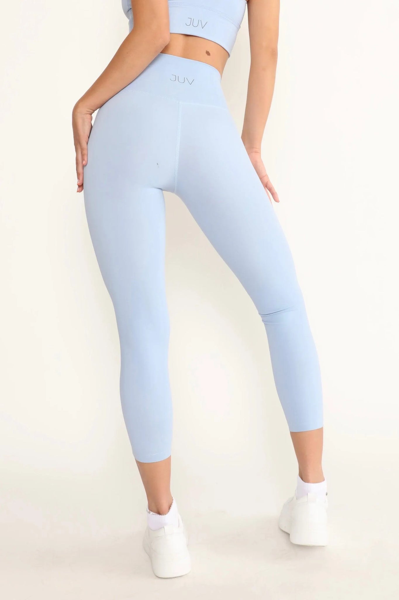 JUV unicorn legging in light blue color, close up back view. blue