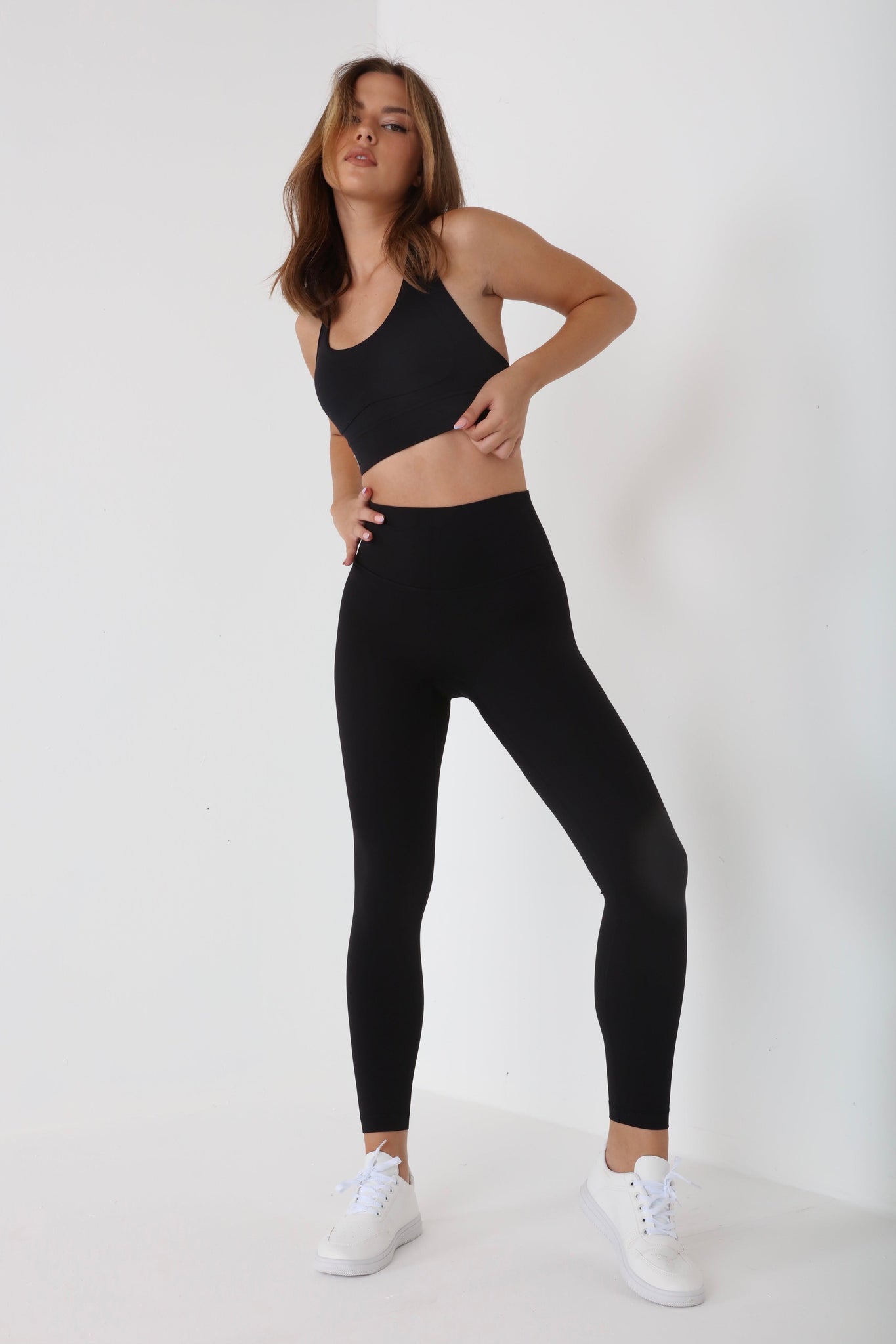 JUV fresh legging in black color with matching top, full body front view.