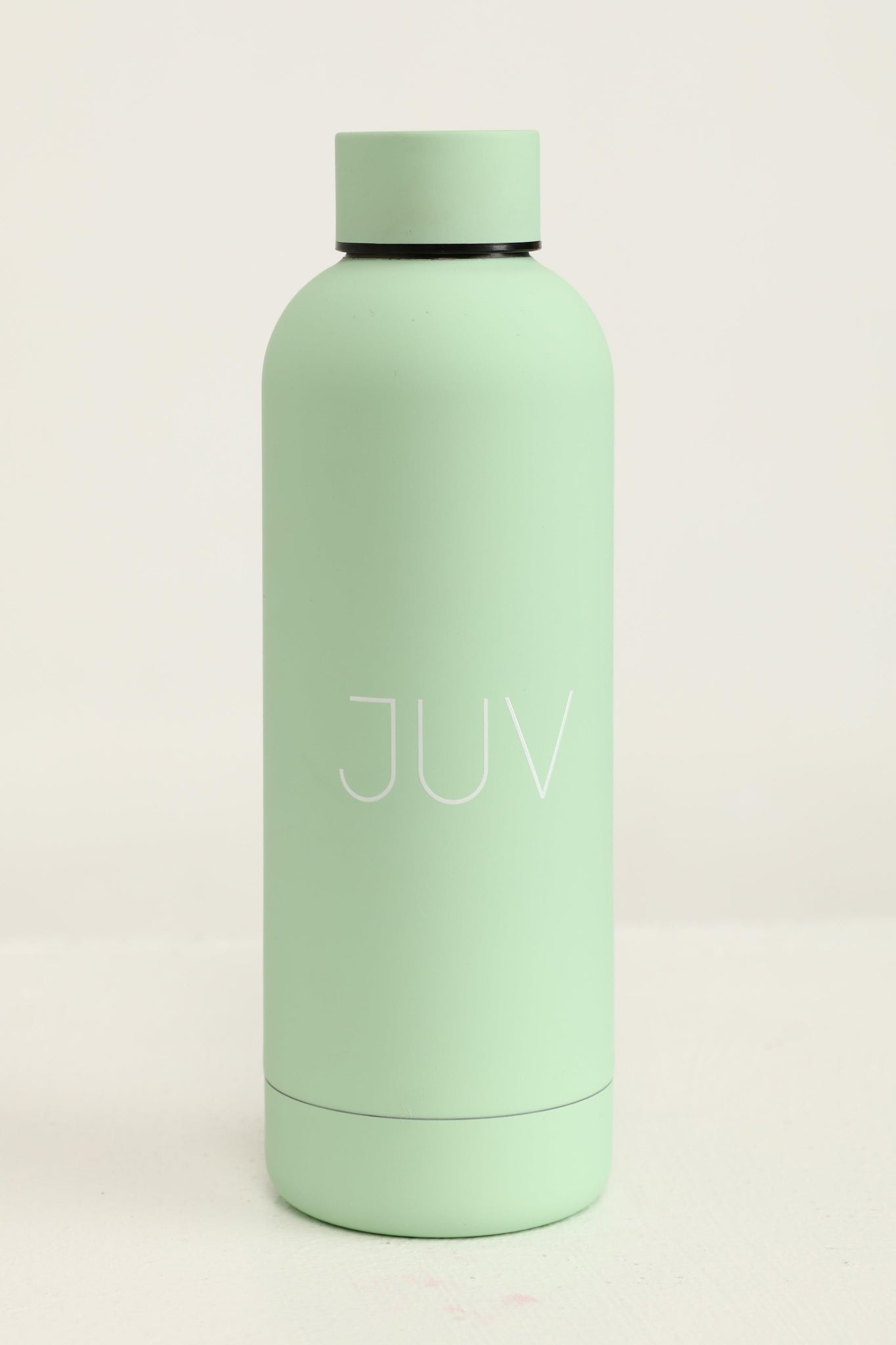 JUV mia thermal bottle in mint green, front view.